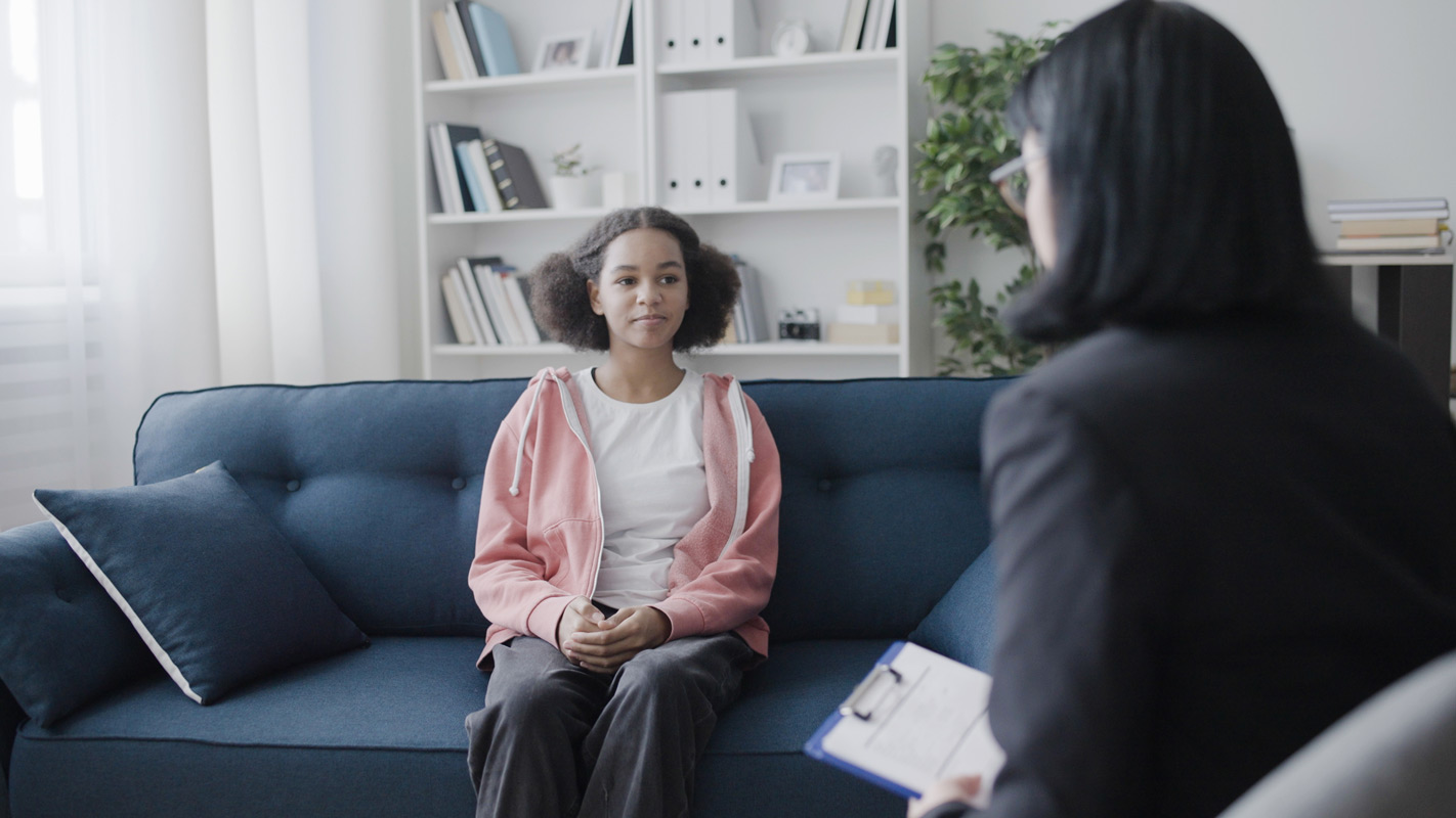 A teenage girl in a therapy session