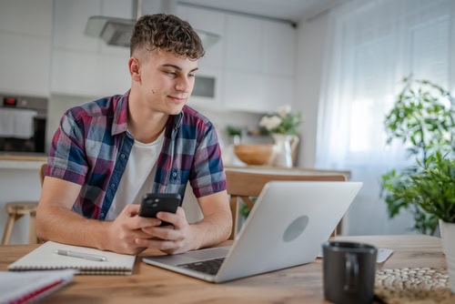 A young man working on his computer