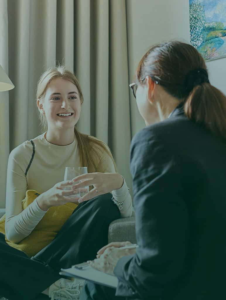Two women talking during a counseling session