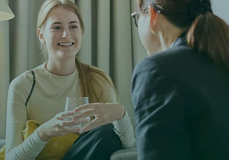 Two women talking during a counseling session