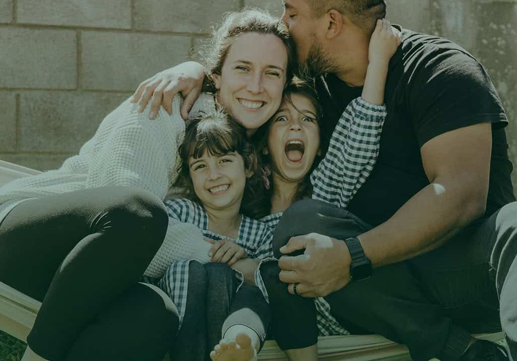 Foster family enjoying quality time outdoors, highlighting the importance of fostering care and supp.
