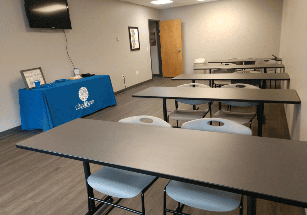 Training room at Omni Visions Northeast Regional Office in Johnson City, featuring tables and chairs.