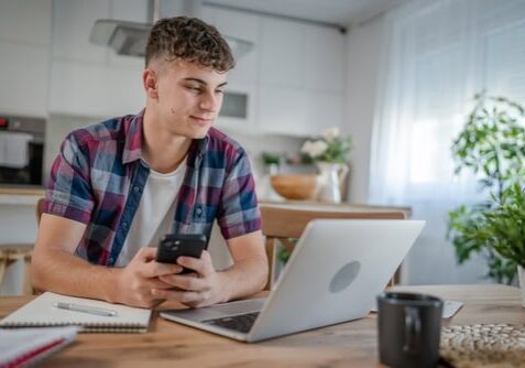 A young man working on his computer